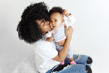 Image showing Portrait of beautiful african woman holding on hands her little baby