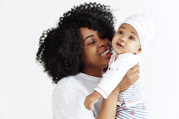 Image showing Portrait of beautiful african woman holding on hands her little baby