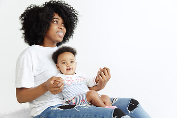 Image showing Portrait of beautiful african woman holding on hands her little baby