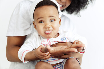 Image showing Portrait of beautiful african woman holding on hands her little baby