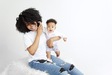 Image showing Portrait of beautiful african woman holding on hands her little baby