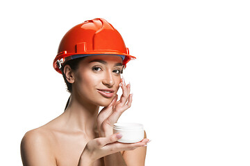 Image showing Portrait of confident female worker in orange helmet