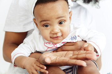 Image showing Portrait of beautiful african woman holding on hands her little baby