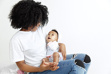 Image showing Portrait of beautiful african woman holding on hands her little baby