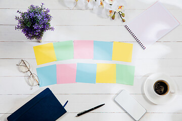 Image showing Message at colorful note papers on a desk background.