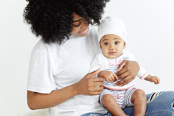 Image showing Portrait of beautiful african woman holding on hands her little baby