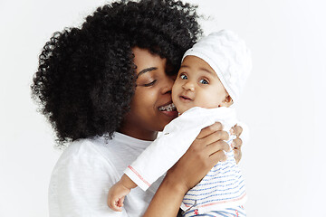 Image showing Portrait of beautiful african woman holding on hands her little baby