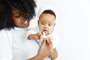 Image showing Portrait of beautiful african woman holding on hands her little baby