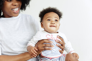 Image showing Portrait of beautiful african woman holding on hands her little baby