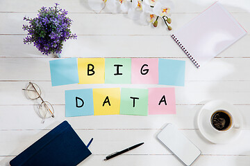 Image showing BIG DATA. Message at colorful note papers on a desk background.