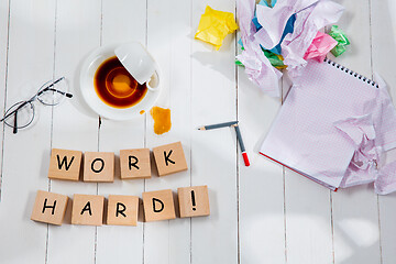 Image showing HARD WORK. Message in wooden cubes on a desk background.