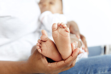 Image showing Portrait of beautiful african woman holding on hands her little baby