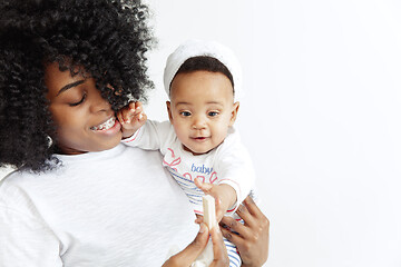 Image showing Portrait of beautiful african woman holding on hands her little baby