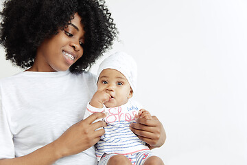 Image showing Portrait of beautiful african woman holding on hands her little baby