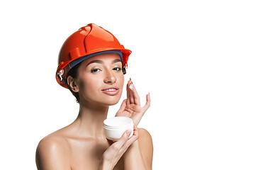 Image showing Portrait of confident female worker in orange helmet