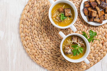 Image showing Traditional French onion soup with toasted bread croutons 