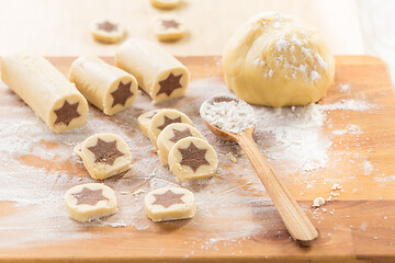 Image showing Baking christmas cookies with chocolate star. 