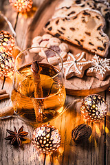 Image showing Apple mulled wine with Christmas Stollen. Traditional Sweet Fruit Loaf with icing sugar.  