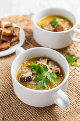 Image showing Traditional French onion soup with toasted bread croutons 