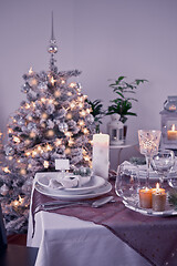 Image showing Table setting for celebration Christmas and New Year Holidays. Festive table at home. 