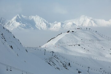 Image showing Snowy skiing slopes from the top