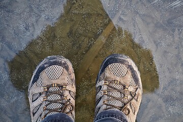 Image showing Standing on ice of frozen lake