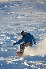 Image showing Snowboarding in fresh powder snow