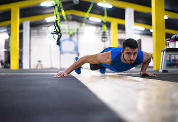 Image showing Young  man doing pushups