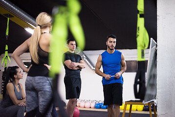 Image showing athletes getting instructions from trainer