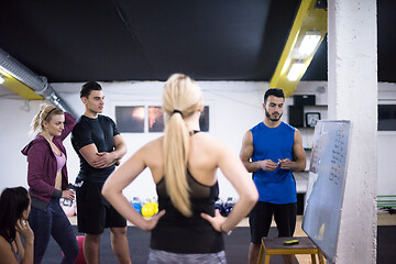 Image showing athletes getting instructions from trainer