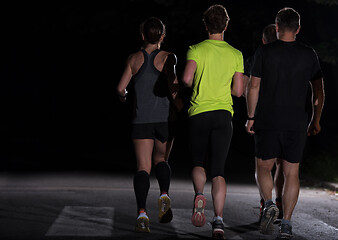 Image showing runners team on the night training