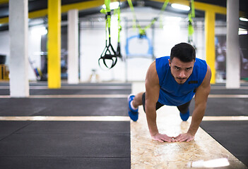 Image showing Young  man doing pushups