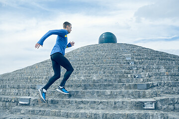 Image showing Man running on city background at morning.