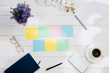 Image showing Message at colorful note papers on a desk background.