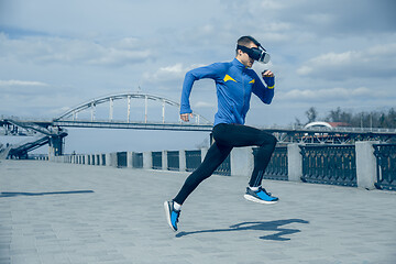 Image showing Man running on city background at morning.