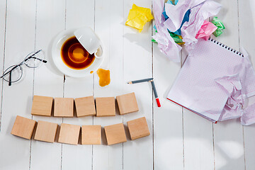 Image showing Message in wooden cubes on a desk background.