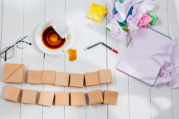 Image showing Message in wooden cubes on a desk background.