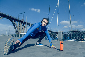 Image showing Man running on city background at morning