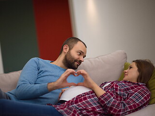 Image showing man and pregnant woman showing heart sign