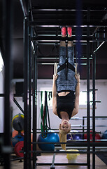 Image showing woman working out on gymnastic rings