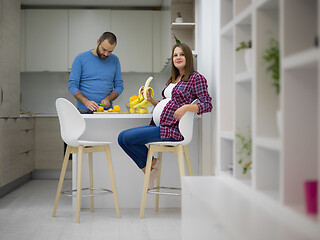 Image showing couple cooking food fruit lemon juice at kitchen