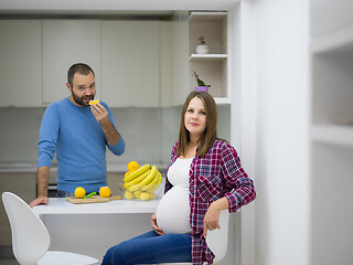 Image showing couple cooking food fruit lemon juice at kitchen