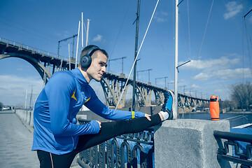 Image showing Man running on city background at morning