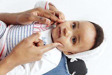 Image showing Portrait of beautiful african woman holding on hands her little baby