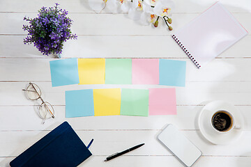 Image showing Message at colorful note papers on a desk background.