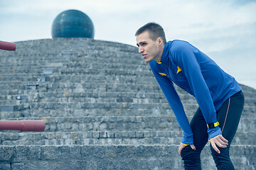 Image showing Man on city background at morning. Healthy lifestyle concept.