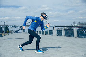 Image showing Man running on city background at morning.