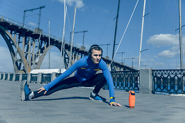 Image showing Man running on city background at morning