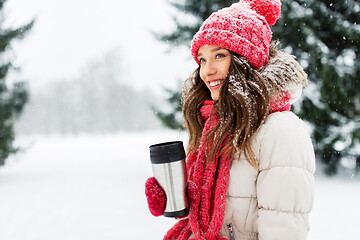 Image showing young woman with hot drink in tumbler in winter