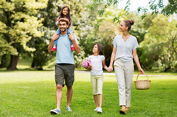 Image showing family with picnic basket walking in summer park